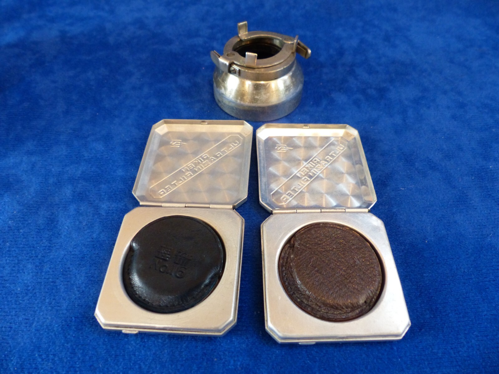 Vintage Riken 25 mm filters in metal cases+clamp-on lens hood in leather case