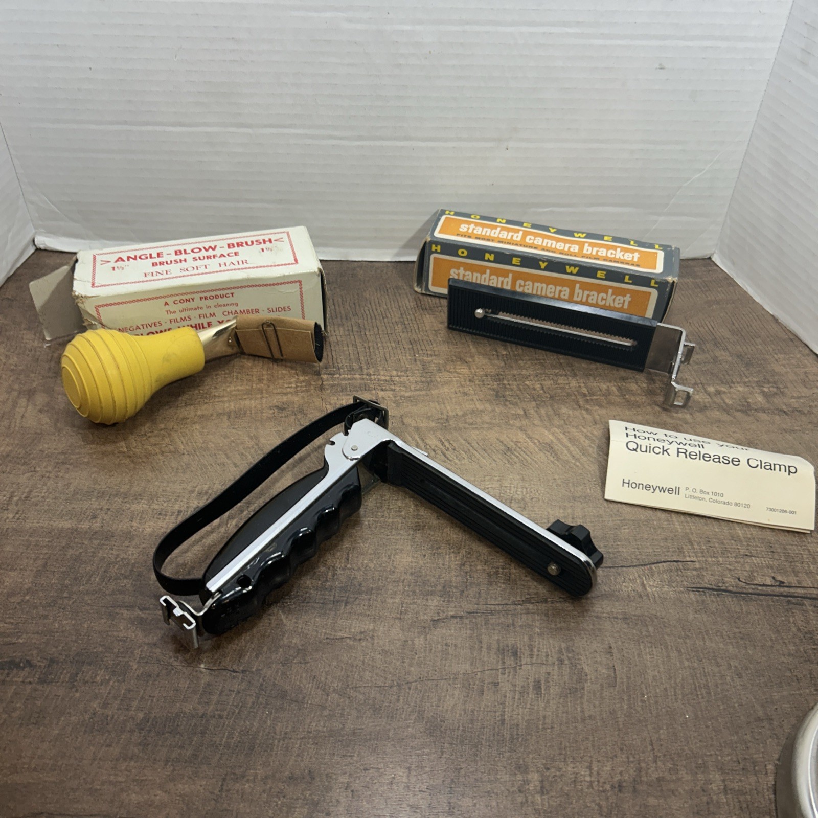 Lot of 3 Vintage camera accessories, 2 camera brackets & 1 angle blow brush