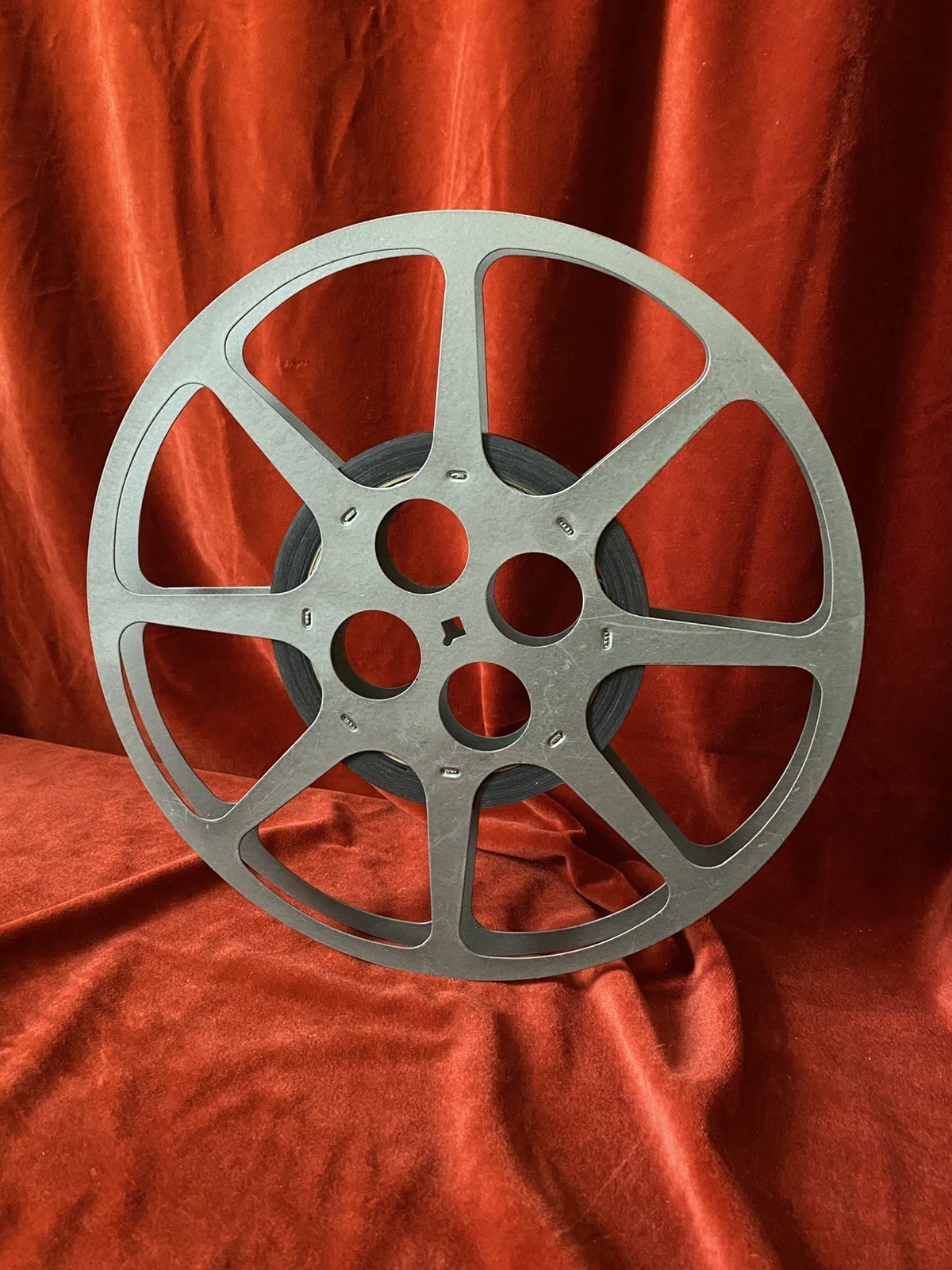 1200 ft Metal Moving Picture Reel 12 1/4” With a piece of an unknown film