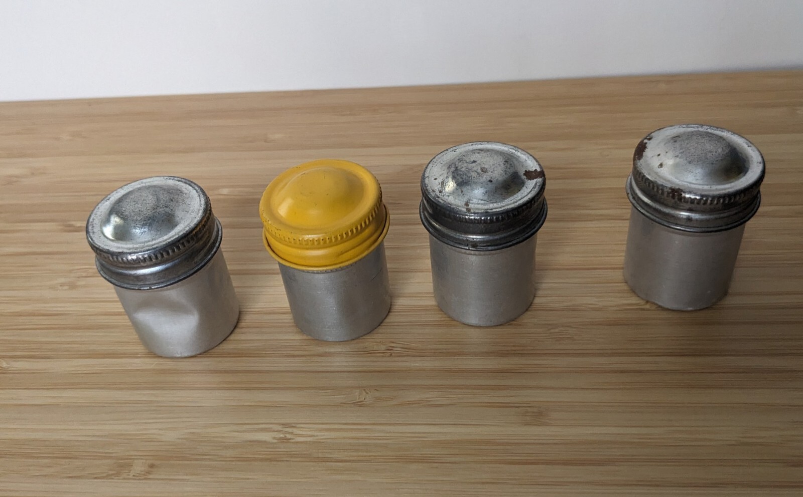 Four Vintage 35mm aluminum film canisters unbranded W/ metal top