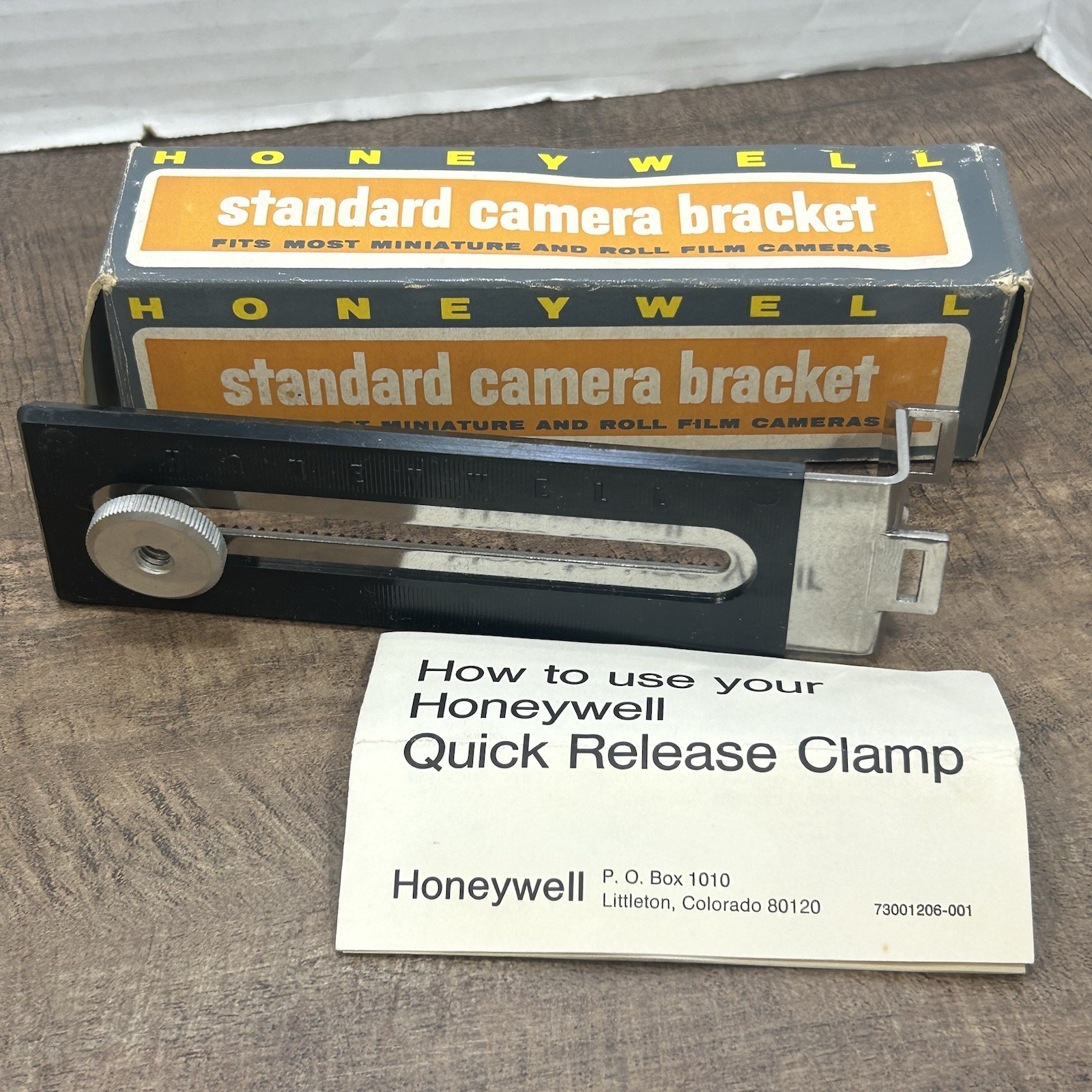 Lot of 3 Vintage camera accessories, 2 camera brackets & 1 angle blow brush
