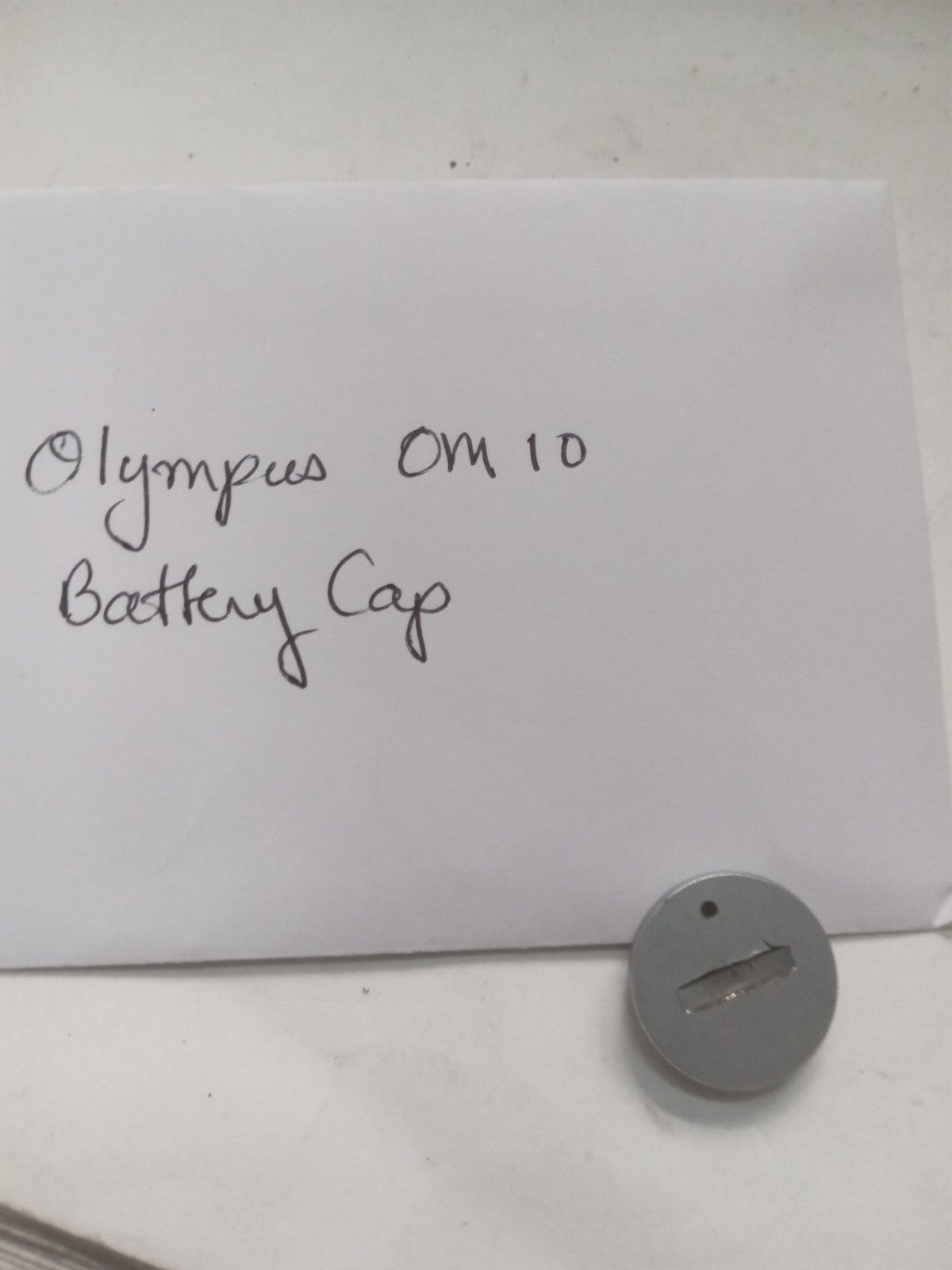 Olympus OM 10 Film SLR Camera Battery Cap Original Used Spare Part