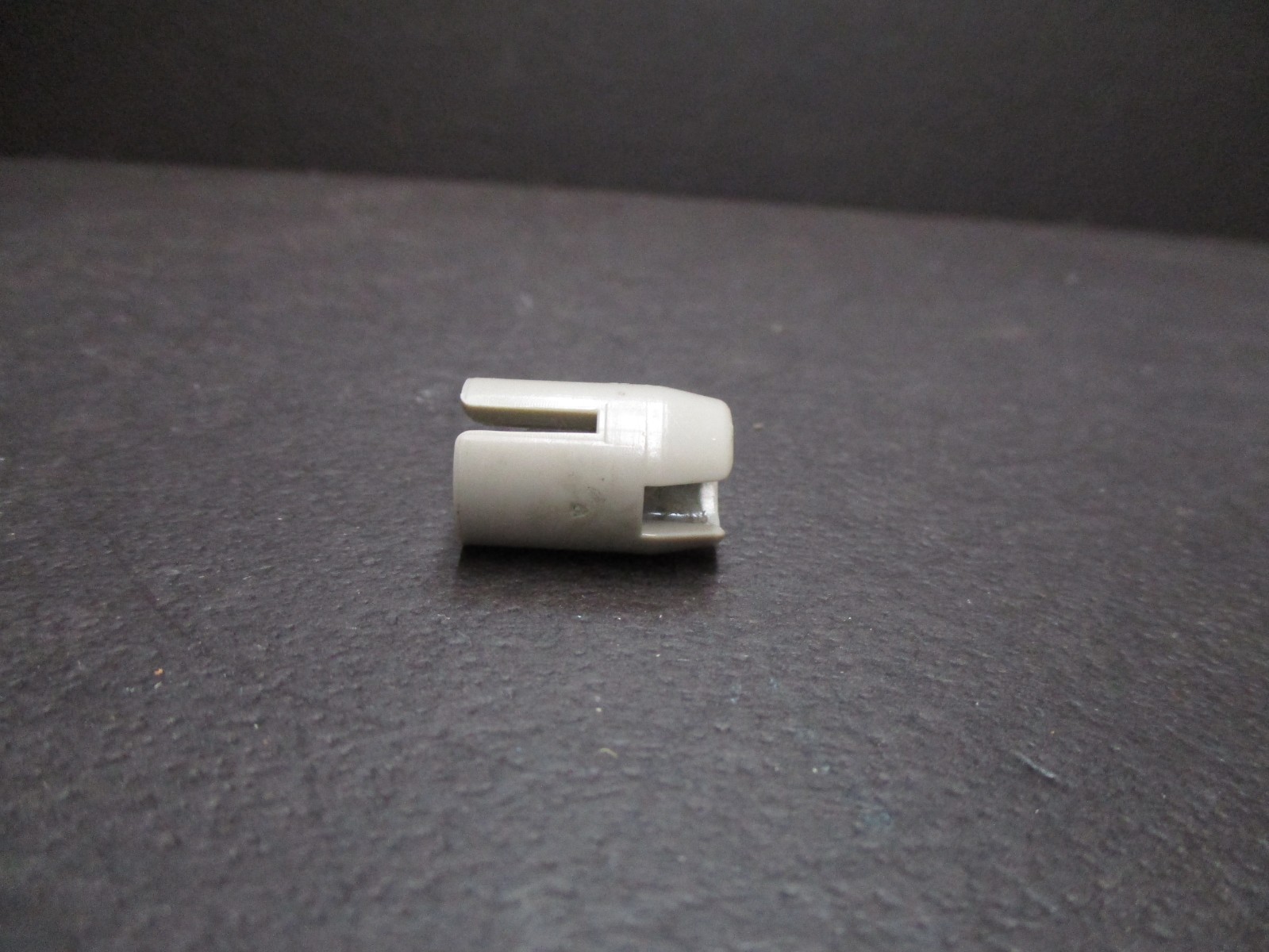 Adapter for a dual 8 movie projector to accept a Super 8 reel.