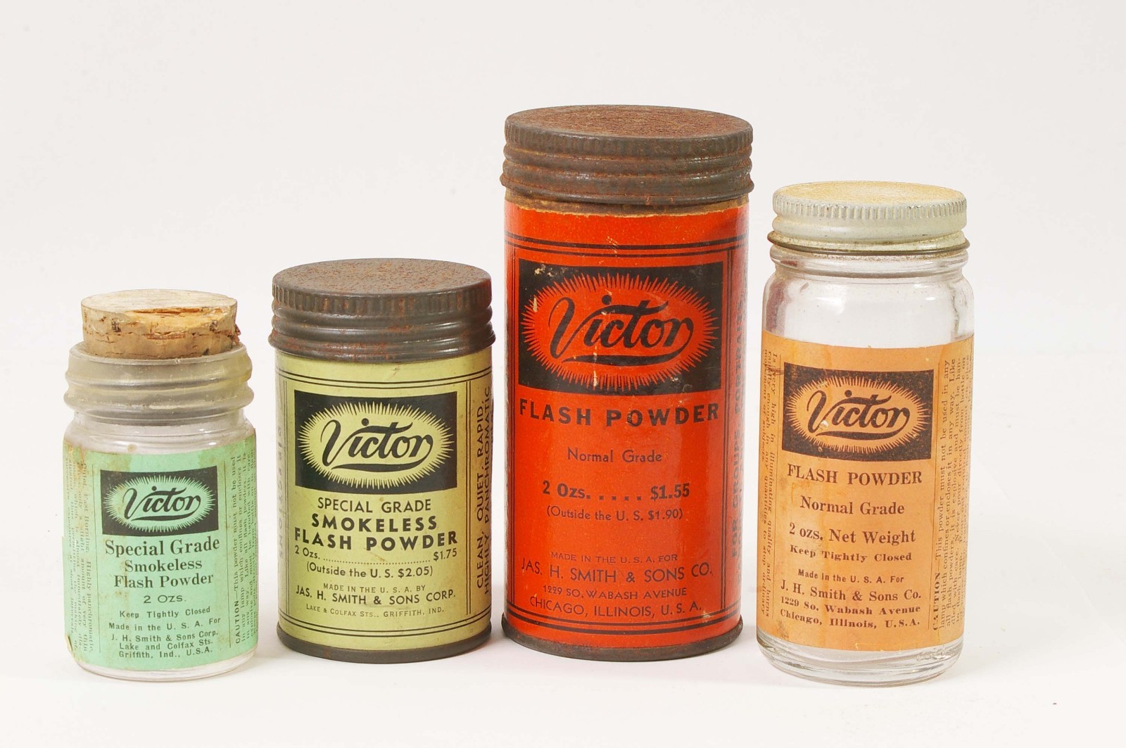 F97917~ Two Victor Flash Powder Cans With Bottles – Empty – J.H. Smith & Sons